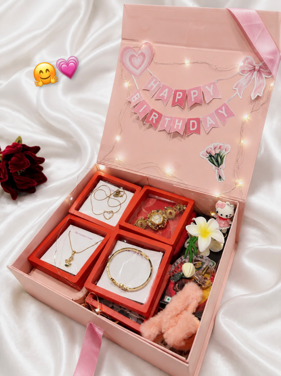 A Curate Crate hamper, opened — fairy lights, jewellery and treats